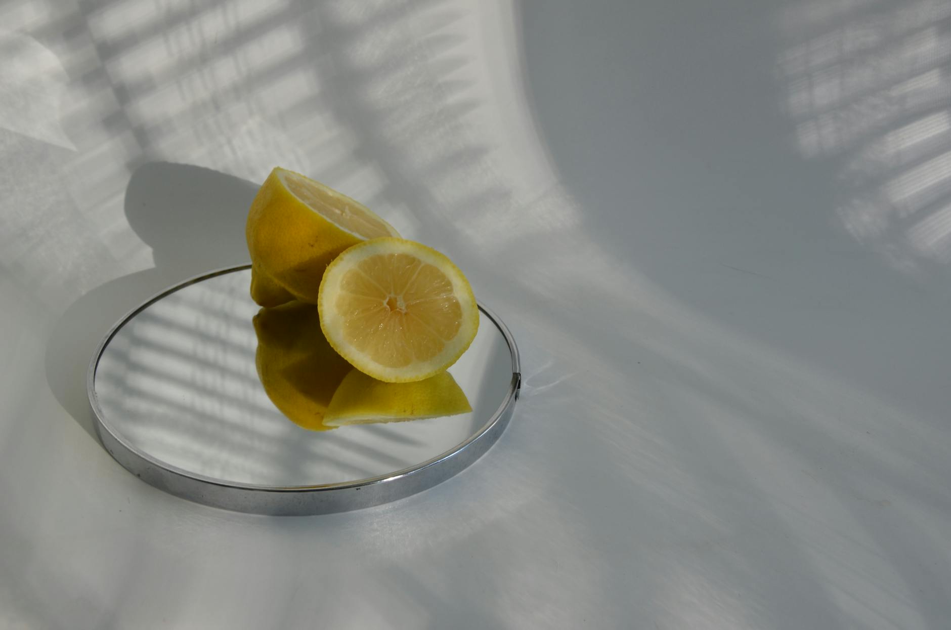 Vibrant display of various clitoral vibrators arranged on a bright yellow surface
